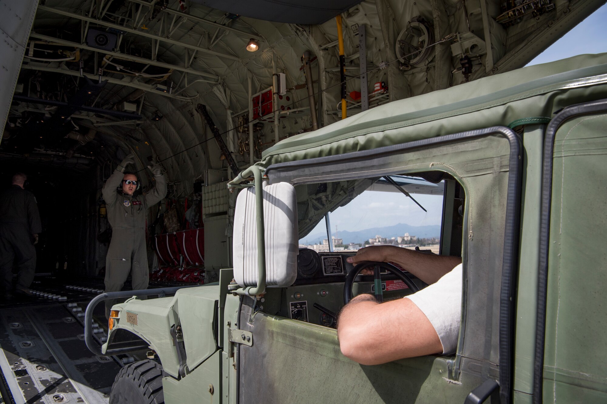 Aircrew with the 36th Airlift Squadron load a Humvee onto a C-130J Super Hercules during the Yokota C-130J Rodeo March 22, 2019, at Yokota Air Base, Japan. The goal of the competition was to have participants demonstrate their capabilities, improve procedures and enhance standardization for tactical operations. (U.S. Air Force photo by Senior Airman Donald Hudson)