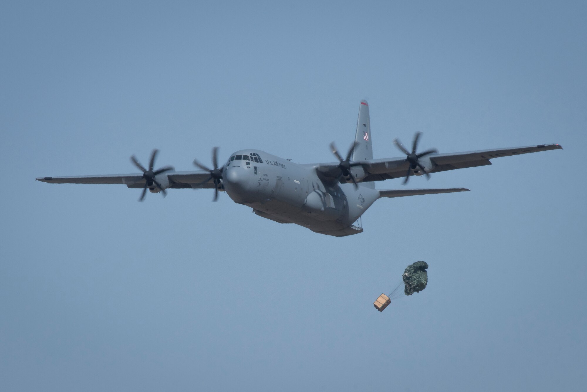 A 36th Airlift Squadron C-130J Super Hercules performs an airdrop during the Yokota C-130J Rodeo March 22, 2019, at Yokota Air Base, Japan. The airdrop portion of the competition tested the ability of pilots and loadmasters ability to execute a mission both accurately and expeditiously. (U.S. Air Force photo by Senior Airman Donald Hudson)