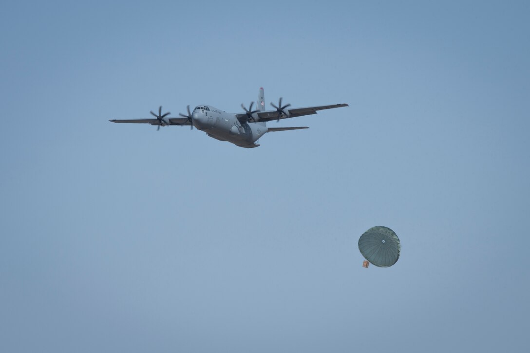 A 36th Airlift Squadron C-130J Super Hercules performs an airdrop during the Yokota C-130J Rodeo March 22, 2019, at Yokota Air Base, Japan. The airdrop portion of the competition tested the ability of pilots and loadmasters ability to execute a mission both accurately and expeditiously. (U.S. Air Force photo by Senior Airman Donald Hudson)