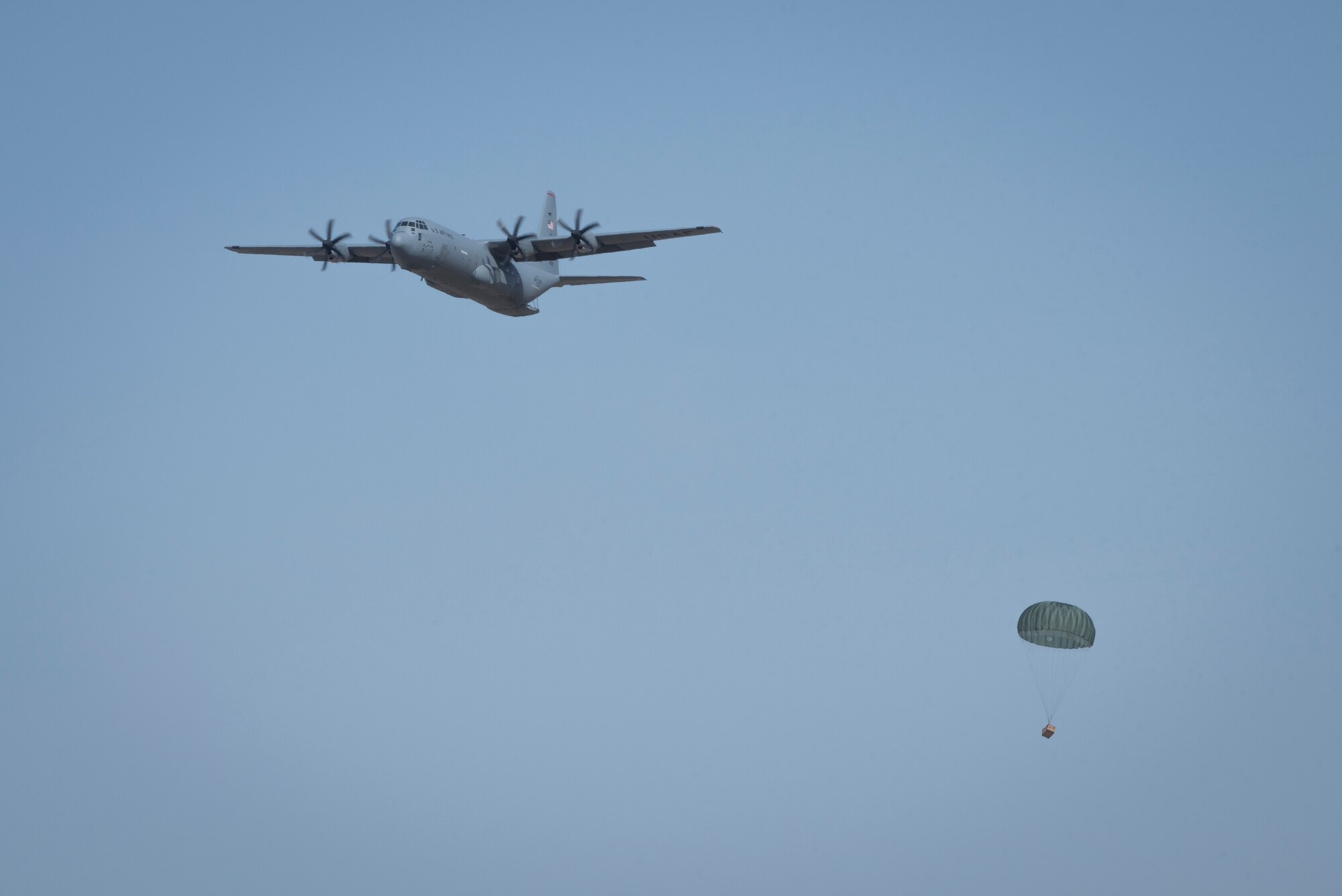 A 36th Airlift Squadron C-130J Super Hercules performs an airdrop during the Yokota C-130J Rodeo March 22, 2019, at Yokota Air Base, Japan. The airdrop portion of the competition tested the ability of pilots and loadmasters ability to execute a mission both accurately and expeditiously. (U.S. Air Force photo by Senior Airman Donald Hudson)