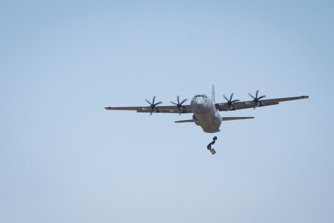 A 36th Airlift Squadron C-130J Super Hercules performs an airdrop during the Yokota C-130J Rodeo March 22, 2019, at Yokota Air Base, Japan. The airdrop portion of the competition tested the ability of pilots and loadmasters ability to execute a mission both accurately and expeditiously. (U.S. Air Force photo by Senior Airman Donald Hudson)
