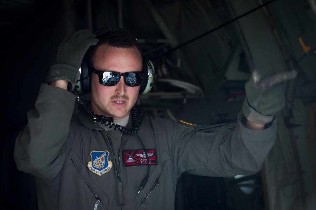 A 36th Airlift Squadron loadmaster directs a Humvee onto a C-130J Super Hercules during the Yokota C-130J Rodeo March 22, 2019, at Yokota Air Base, Japan. The competition demonstrated various combat capabilities and standards of the C-130 aircrews. (U.S. Air Force photo by Senior Airman Donald Hudson)