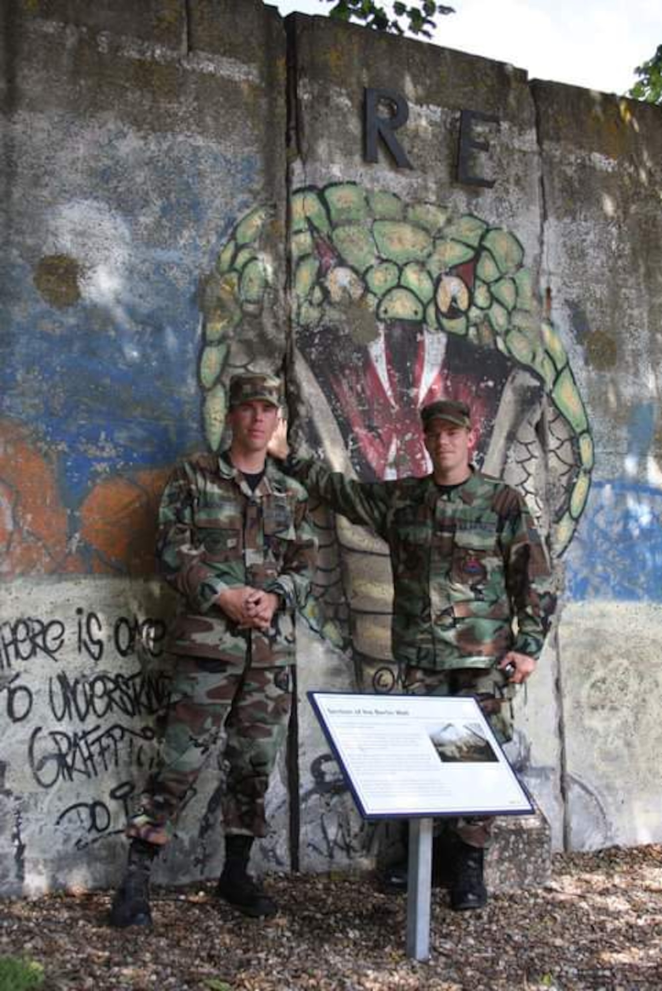 Now Tech. Sgt. John Beckett, left, 379th Expeditionary Civil Engineer Squadron (ECES) heavy equipment project lead, and his brother, now Master Sgt. Christopher Beckett, 379th ECES heavy equipment section chief, pose for a photo during a trip to England in 2009. The brothers, who have served in the same Arizona Air National Guard since 2003, are currently deployed together to the same ECES unit at Al Udeid Air Base, Qatar.