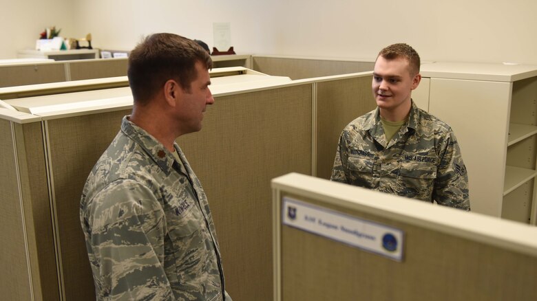Chaplain (Maj.) Bradley Kimble, 14th Flying Training Wing deputy chaplain, speaks with Airman 1st Class Logan Snodgrass, 14th Contracting Squadron journeyman, March 25, 2019, on Columbus Air Force Base, Mississippi. The chapel team routinely visits shops around base and talks with Airmen about their work and personal lives. (U.S. Air Force photo by Senior Airman Beaux Hebert)