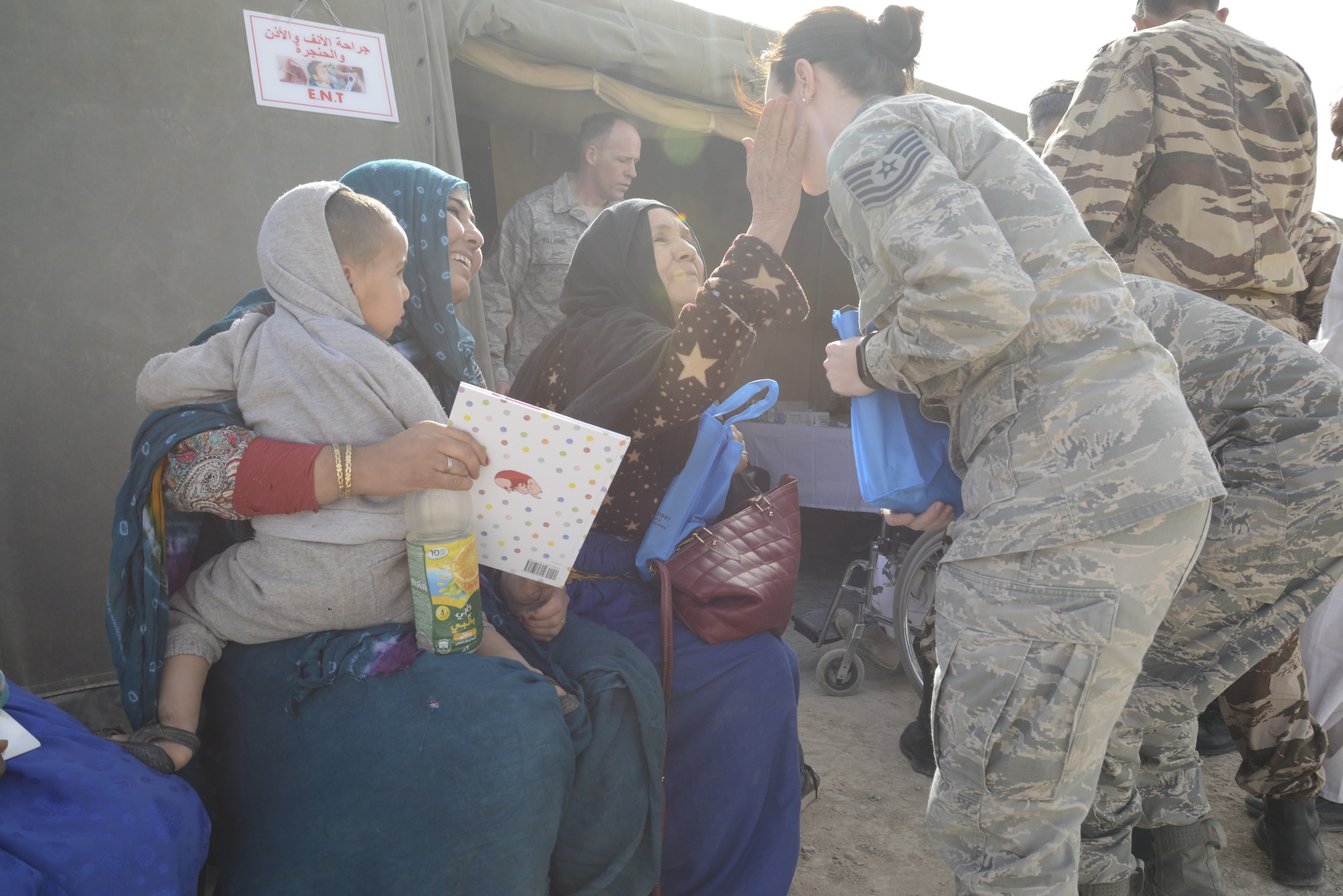 U.S. Air Force Tech. Sgt. Kelsey Roney, a logistics technician with the Utah Air National Guard greets patients during the humanitarian civic assistance component of exercise African Lion 2019 in Tata, Morocco, March 25, 2019. Exercise African Lion 2019 is a Chairman of the Joint Chiefs of Staff-sponsored, U.S. African Command-scheduled, U.S. Marine Corps Forces Europe and Africa-led, joint and combined exercise conducted in the Kingdom of Morocco. African Lion offers an opportunity for participation in a multinational exercise to enhance our professional relationships and allow support for interoperability of forces. (U.S. Air Force photo by Maj. Janine Smith)