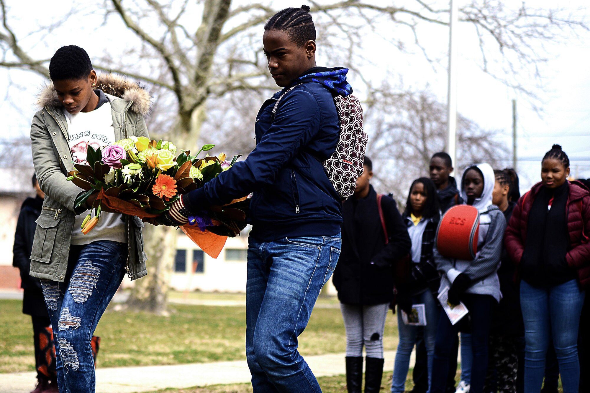 Students from the French Caribbean island of Martinique prepare to lay a wreath of remembrance during a visit to Joint Base McGuire-Dix-Lakehurst, N.J., March 25, 2019. The wreath was in honor of French dissidents who escaped the islands and fought for their freedom during World War II. The dissidents received their combat training at Fort Dix in the 1940s. (U.S. Air Force photo by Tech. Sgt. Austin Knox)
