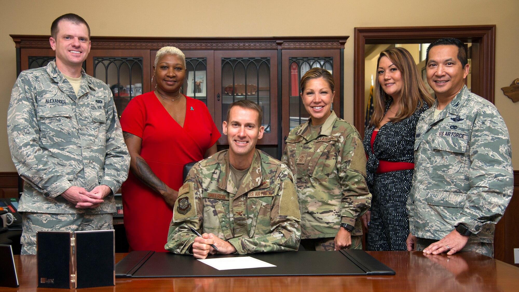 U.S. Air Force Col. Stephen Snelson, 6th Air Mobility Wing commander, signs a proclamation for Sexual Assault Awareness and Prevention Month (SAAPM) at MacDill Air Force Base, Fla., Mar. 27, 2019. Throughout the month of April, MacDill’s Sexual Assault Prevention and Response Office hosts multiple events to increase public awareness about sexual violence and educate the community on how to prevent it. (U.S. Air Force photo by Senior Airman Heather Fejerang)