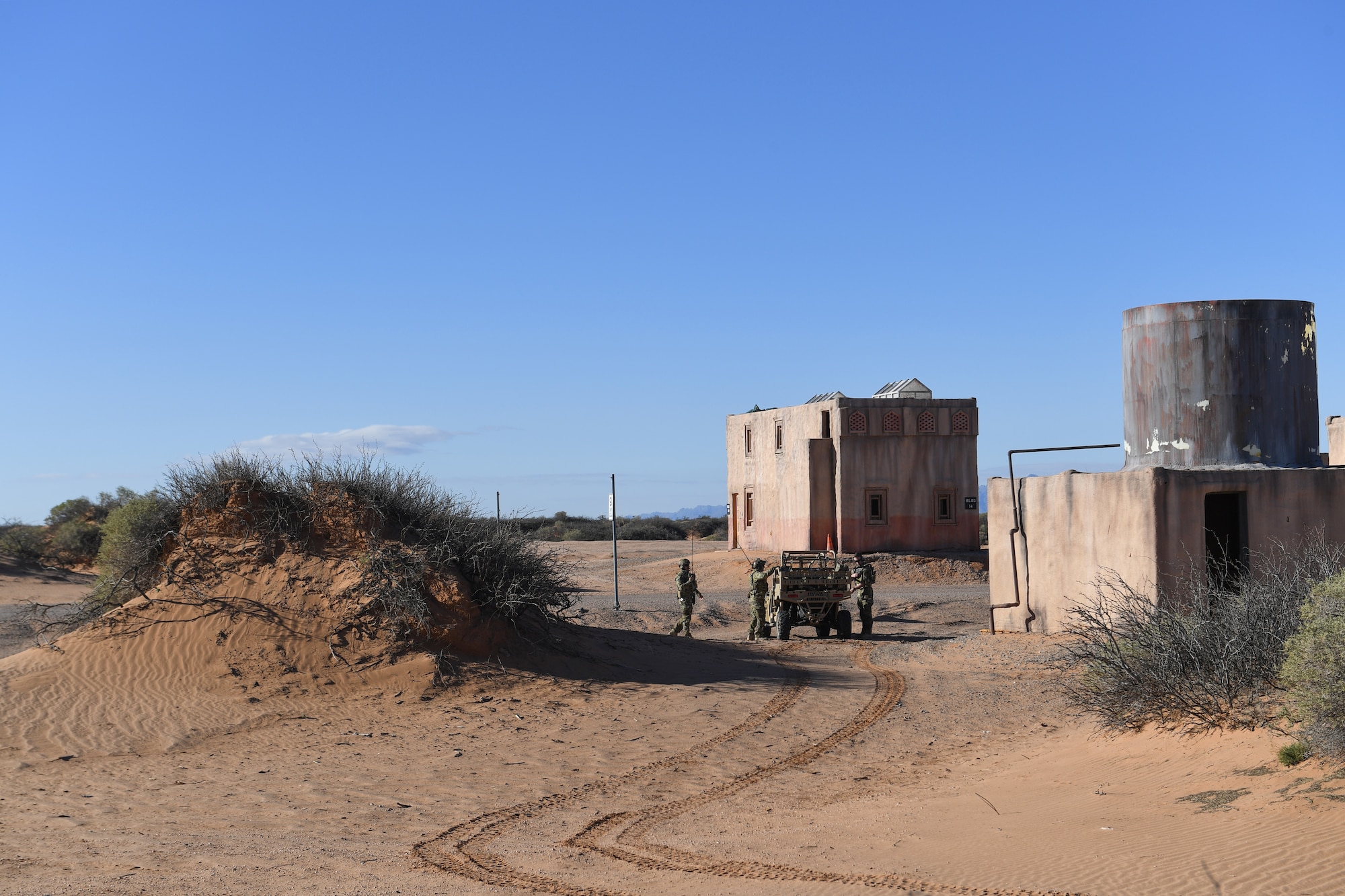 U.S. Air Force combat rescue officer students from the 351st Special Warfare Training Squadron train with tactical air control party members, assigned to the 7th Air Support Operations Squadron, on calling in close air support and nine lines on Red Rio Range, N.M., March 14, 2019. The CROs and TACPs worked with MQ-9 Reapers from Holloman Air Force Base, N.M., to simulate real world scenarios and improve communication with the pilots. (U.S. Air Force photo by  Senior Airman Haley Phillips)