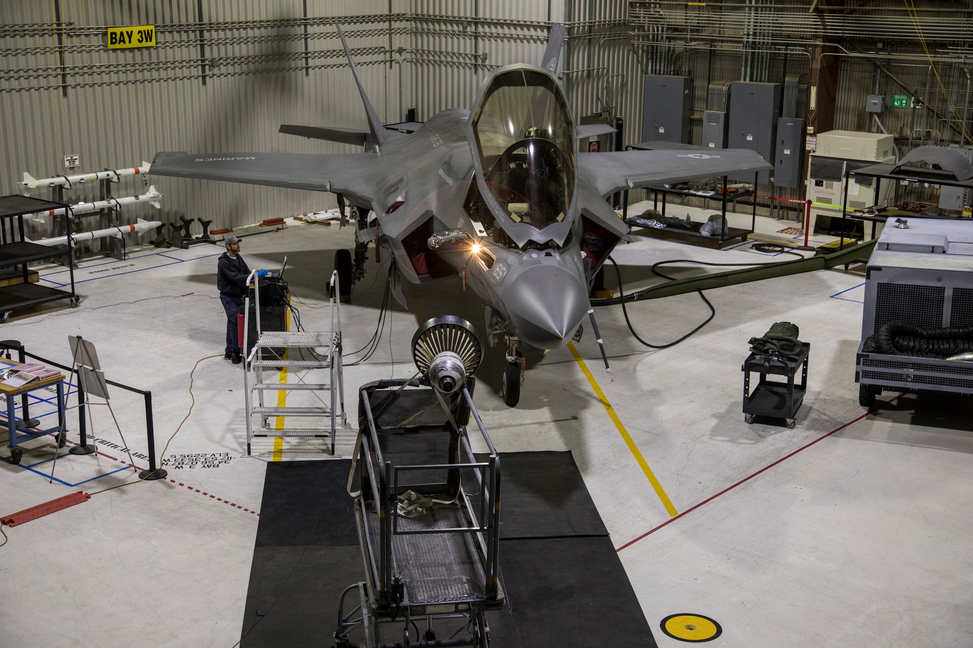 A U.S. Marine Corps F-35B from Air Test and Evaluation Squadron 23 (VX-23), Naval Air Station Patuxent River, Maryland, undergoes a ground test of an improved probe light assembly in an Edwards Air Force Base hangar Feb. 28. The F-35 program recently completed testing on an improved lighting assembly with the KC-135 Stratotanker that will enable the Navy and Marine Corps F-35 variants to refuel behind the tanker at night. Flight testing of the redesigned light, which attaches to a refueling probe, was led by Patuxent River Naval Air Station, Maryland, and supported by Edwards Air Force Base, California. (Courtesy photo by Jonathan Case/Lockheed Martin)