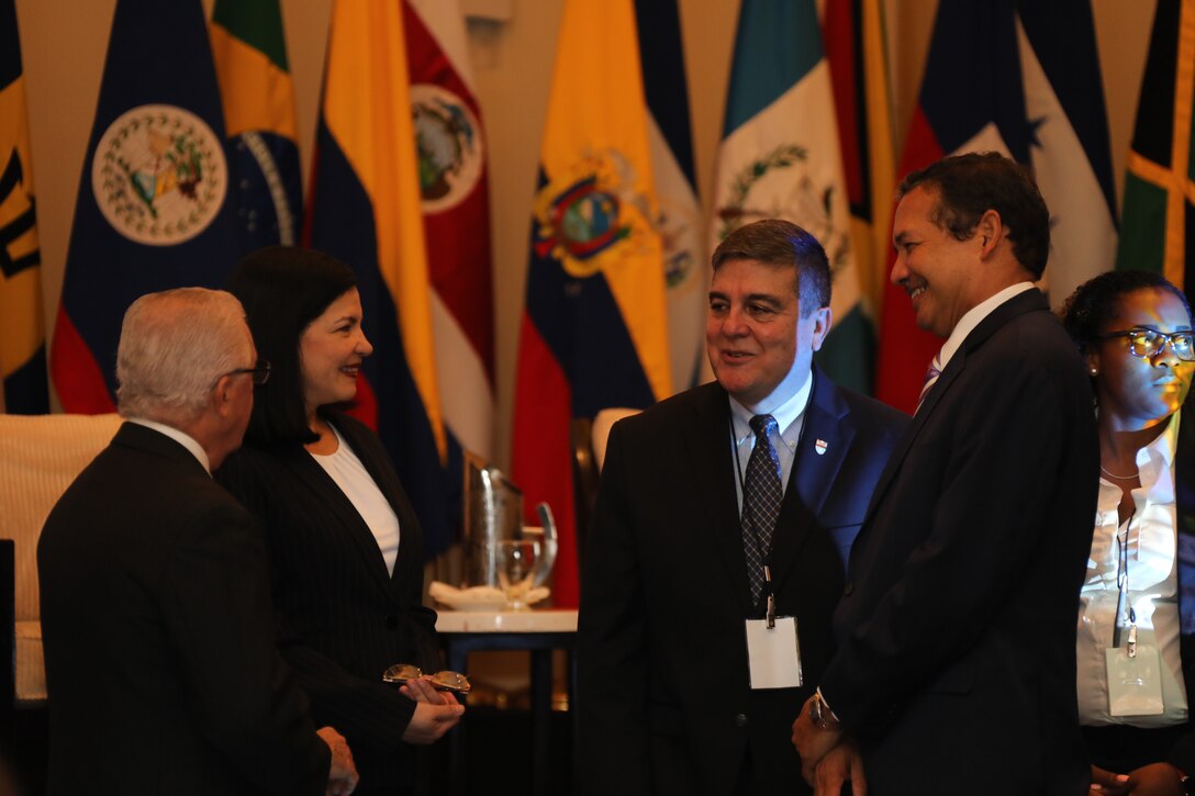 The Command Surgeon of U.S. Southern Command, Air Force Col. Guillermo J. Tellez, speaks with attendees of the Global Health Security of the Americas Conference in Panama.