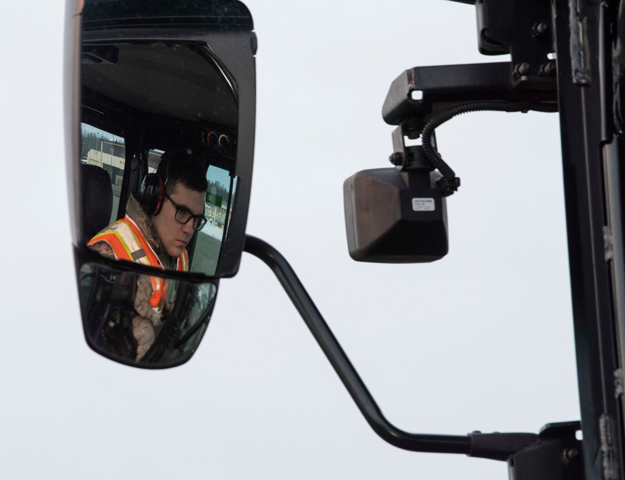A 10K all-terrain forklift driver receives directions outside the Joint Mobility Complex during Polar Force 19-4 at Joint Base Elmendorf-Richardson, Alaska, March 25, 2019. Polar Force is a two-week exercise designed to test JBER’s mission readiness, and develops the skills service members require to face adverse situations.