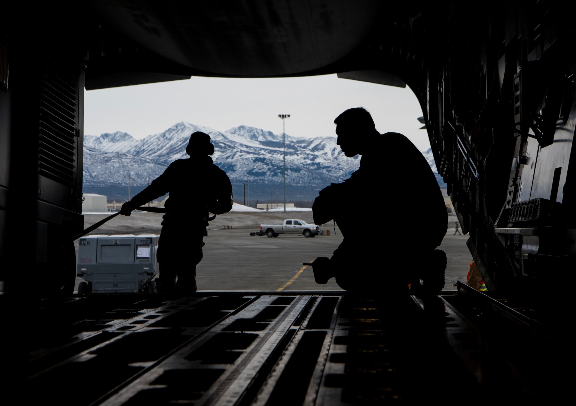 Airmen load cargo onto a C-17 Globemaster III during Polar Force 19-4 at Joint Base Elmendorf-Richardson, Alaska, March 25, 2019. Polar Force is a two-week exercise designed to test JBER’s mission readiness, and develops the skills service members require to face adverse situations.