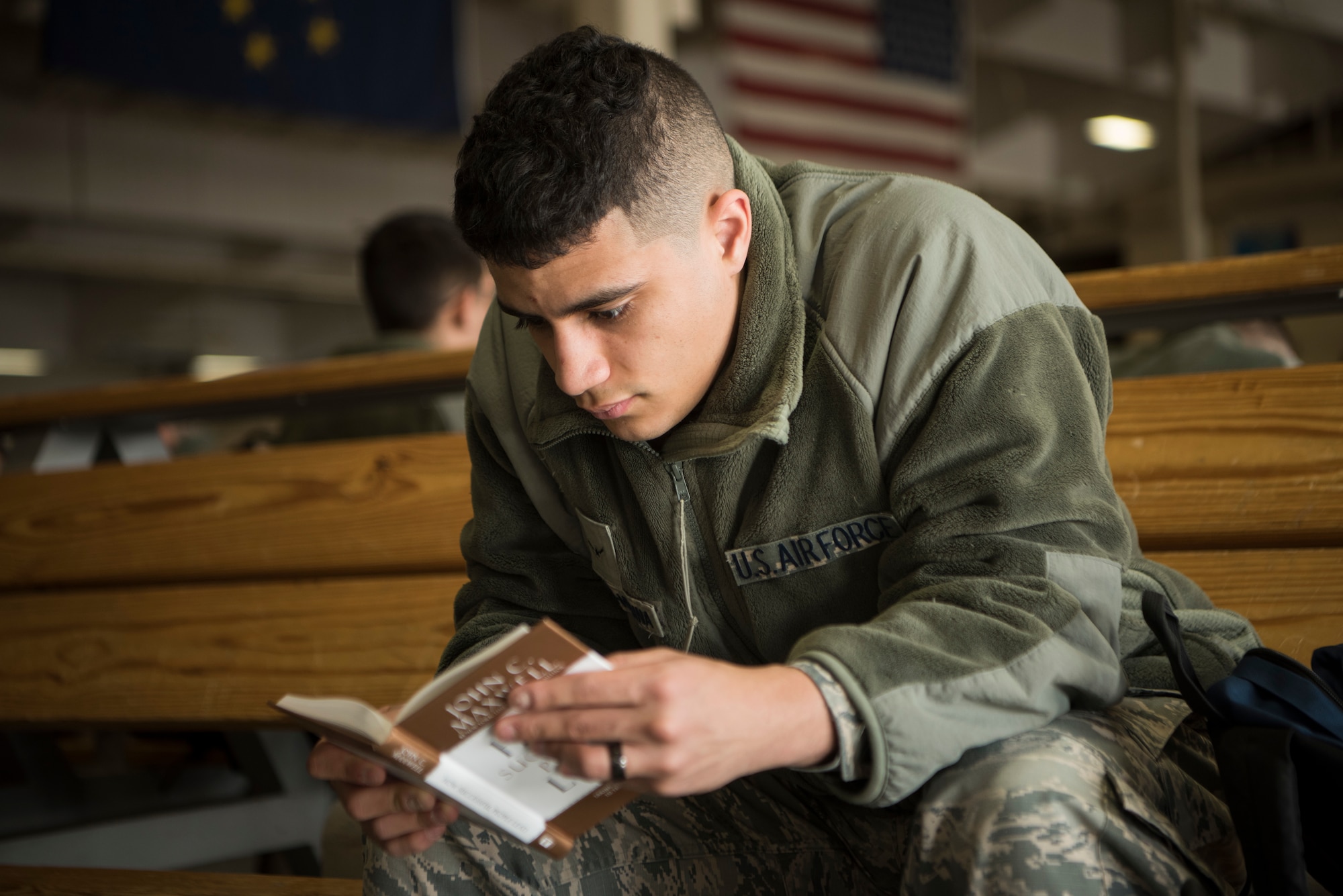 An Airman reads a book while he waits at the Joint Mobility Complex during Polar Force 19-4 at Joint Base Elmendorf-Richardson, Alaska, March 25, 2019. Polar Force is a two-week exercise designed to test JBER’s mission readiness, and develops the skills service members require to face adverse situations.