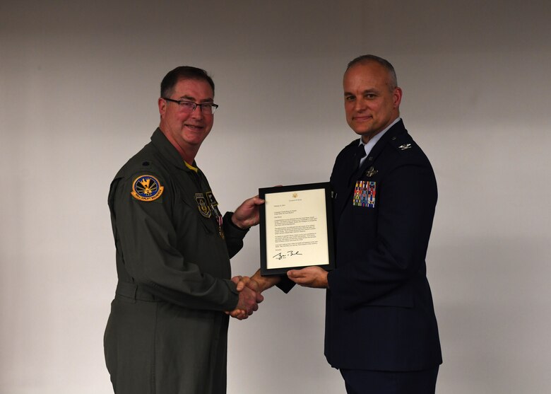 Lt. Col. Bryan Branby, chief of the 911th Airlift Wing Program Integration Office, receives his retirement certificate from Col. Jay D. Miller, vice commander of the 911th AW, at the Pittsburgh International Airport Air Reserve Station, Pennsylvania, March 22, 2019. Branby’s family and friends joined him at his retirement ceremony to celebrate the long career he has had and support him on his next adventure. (U.S. Air Force photo by Senior Airman Grace Thomson)