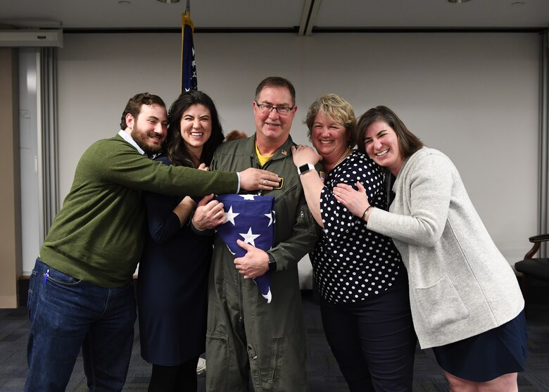 Lt. Col. Bryan Branby, chief of the 911th Airlift Wing Program Integration Office, Laura Branby, his wife, Kara Branby, Jill Branby, and Kurt Branby, his children, pose for a family photo at the Pittsburgh International Airport Air Reserve Station, Pennsylvania, March 22, 2019. Branby’s family joined him for his retirement ceremony to celebrate the long career he has had in the U.S. Air Force Reserves. (U.S. Air Force photo by Senior Airman Grace Thomson)