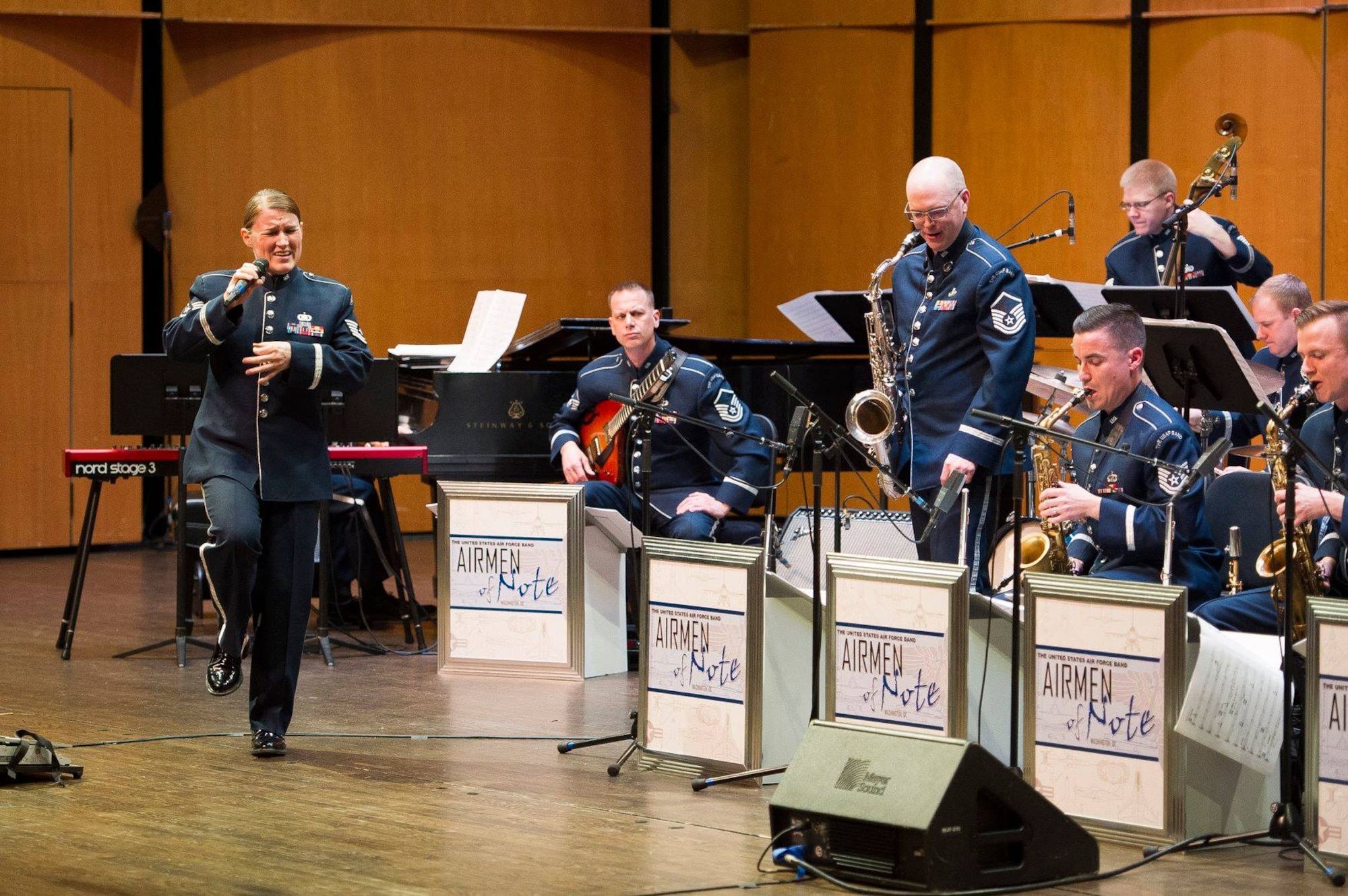 Tech. Sgt. Paige Wroble, Airmen of Note vocalist, left, sings during a Jazz Heritage Series concert at the Rachel M. Schlesinger Concert Hall and Arts Center on the Northern Virginia Community College campus in Alexandria, Va., March 22, 2019. (U.S. Air Force photo by Master Sgt. Michael B. Keller)