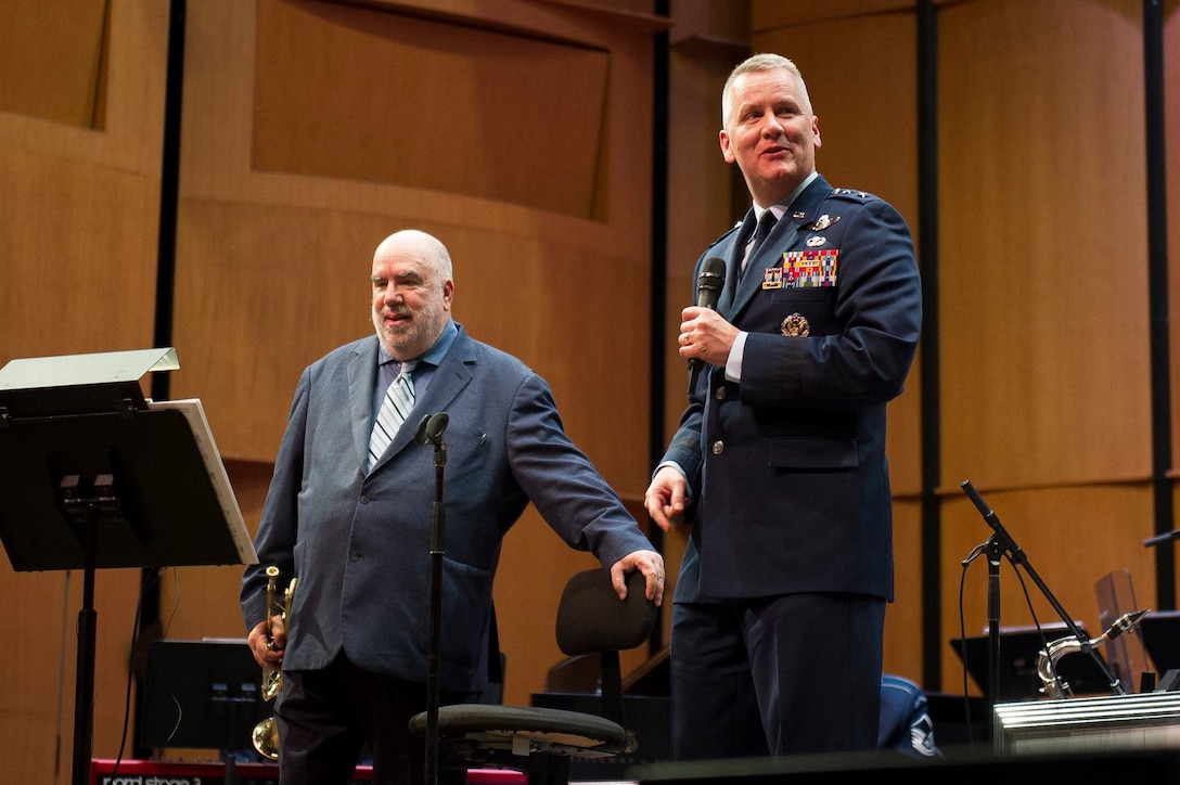 Maj. Gen. James A. Jacobson, Air Force District of Washington commander, right, thanks trumpeter and composer Randy Brecker after a Jazz Heritage Series concert with the U.S. Air Force Band's premier jazz ensemble, Airmen of Note, at the Rachel M. Schlesinger Concert Hall and Arts Center on the Northern Virginia Community College campus in Alexandria, Va., March 22, 2019. (U.S. Air Force photo by Master Sgt. Michael B. Keller)