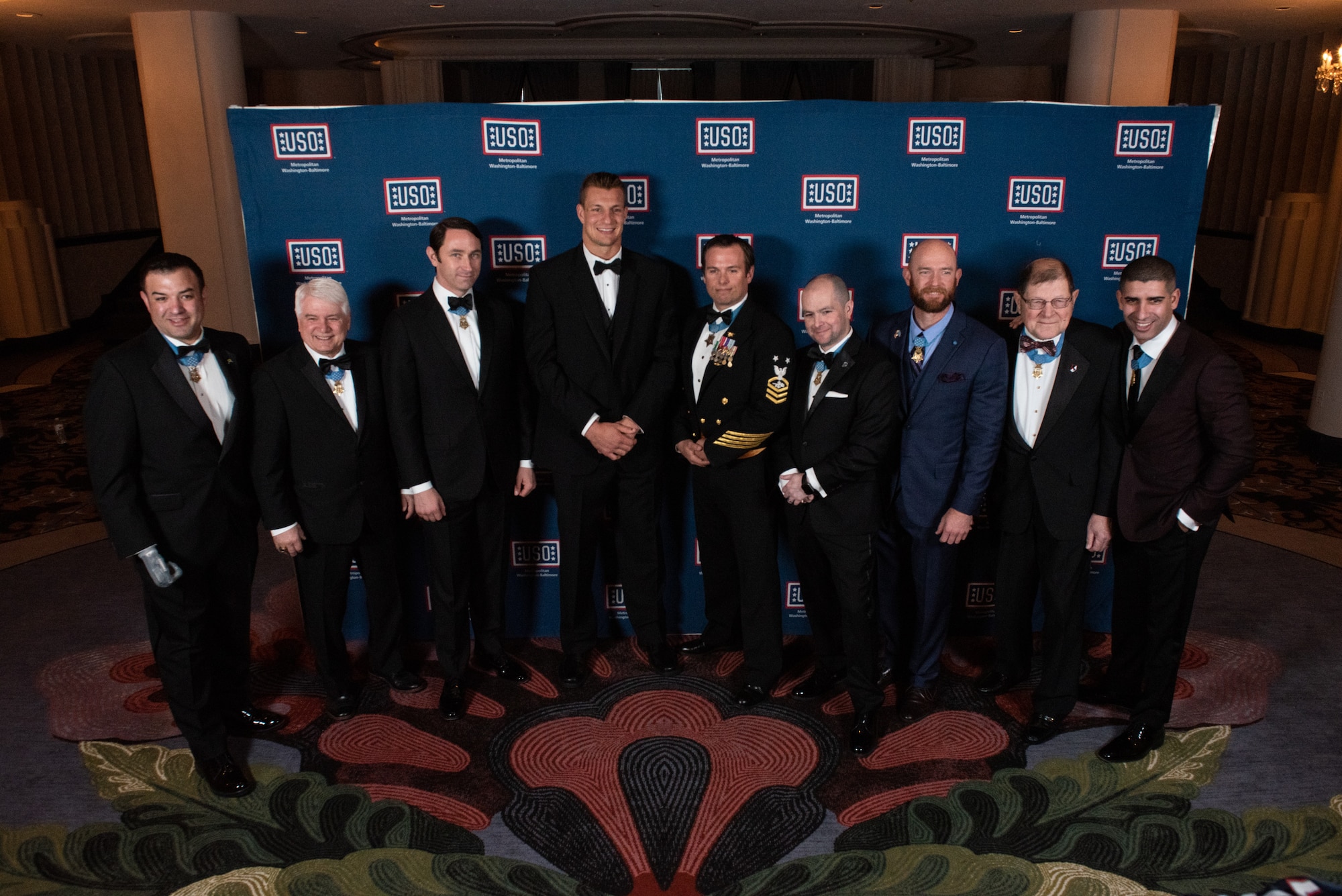 Rob Gronkowski, three-time Super Bowl champion, poses for a photo with multiple Medal of Honor Recipients before the USO Metropolitan Washington – Baltimore 37th Annual Awards Dinner, March 26, 2019, in Washington, D.C. This year’s theme saluted Medal of Honor recipients.