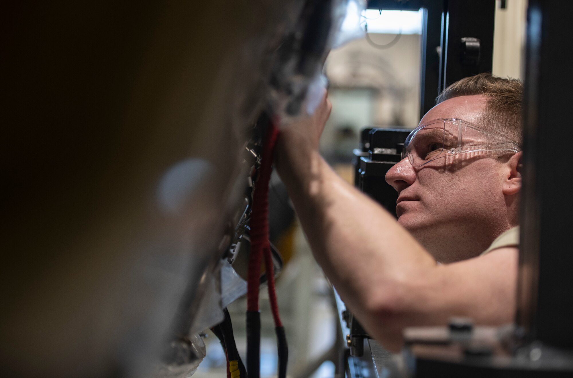 U.S. Air Force Senior Airman Nathan Evans, 20th Component Maintenance Squadron aerospace propulsion technician, inspects an F-16 Viper engine at Shaw Air Force Base, S.C., March 27, 2019.