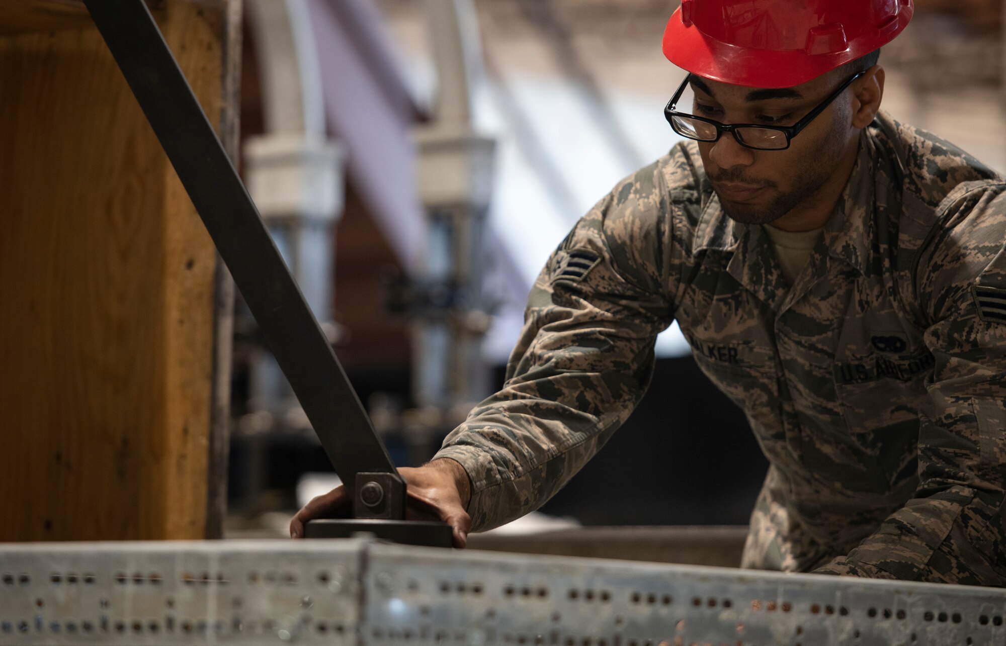 U.S. Air Force Senior Airman Bryan Walker, 20th Component Maintenance Squadron aerospace propulsion technician, secures an F-16 Viper engine part at Shaw Air Force Base, S.C., March 27, 2019.
