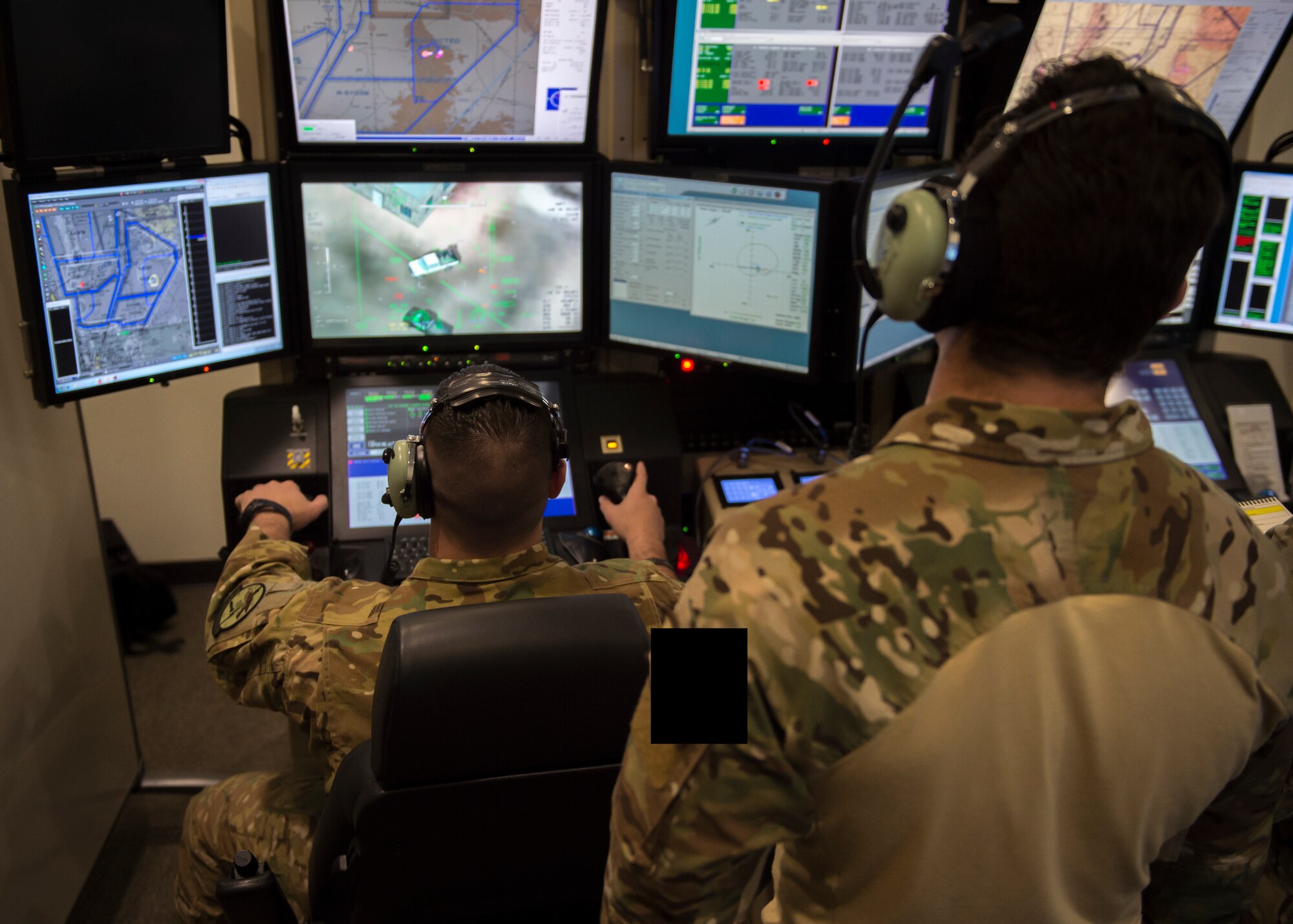 1st Lt. Aleksandr, 351st Special Warfare Training Squadron combat rescue officer student, observes a simulated exercise, March 13, 2019, at the 16th Training Squadron on Holloman Air Force Base, N.M. The MQ-9 is an armed, multi-mission remotely piloted aircraft that is employed primarily against execution targets and secondarily as an intelligence collection asset. Last names have been withheld due to operational security restraints. (U.S. Air Force photo by Airman 1st Class Kindra Stewart)