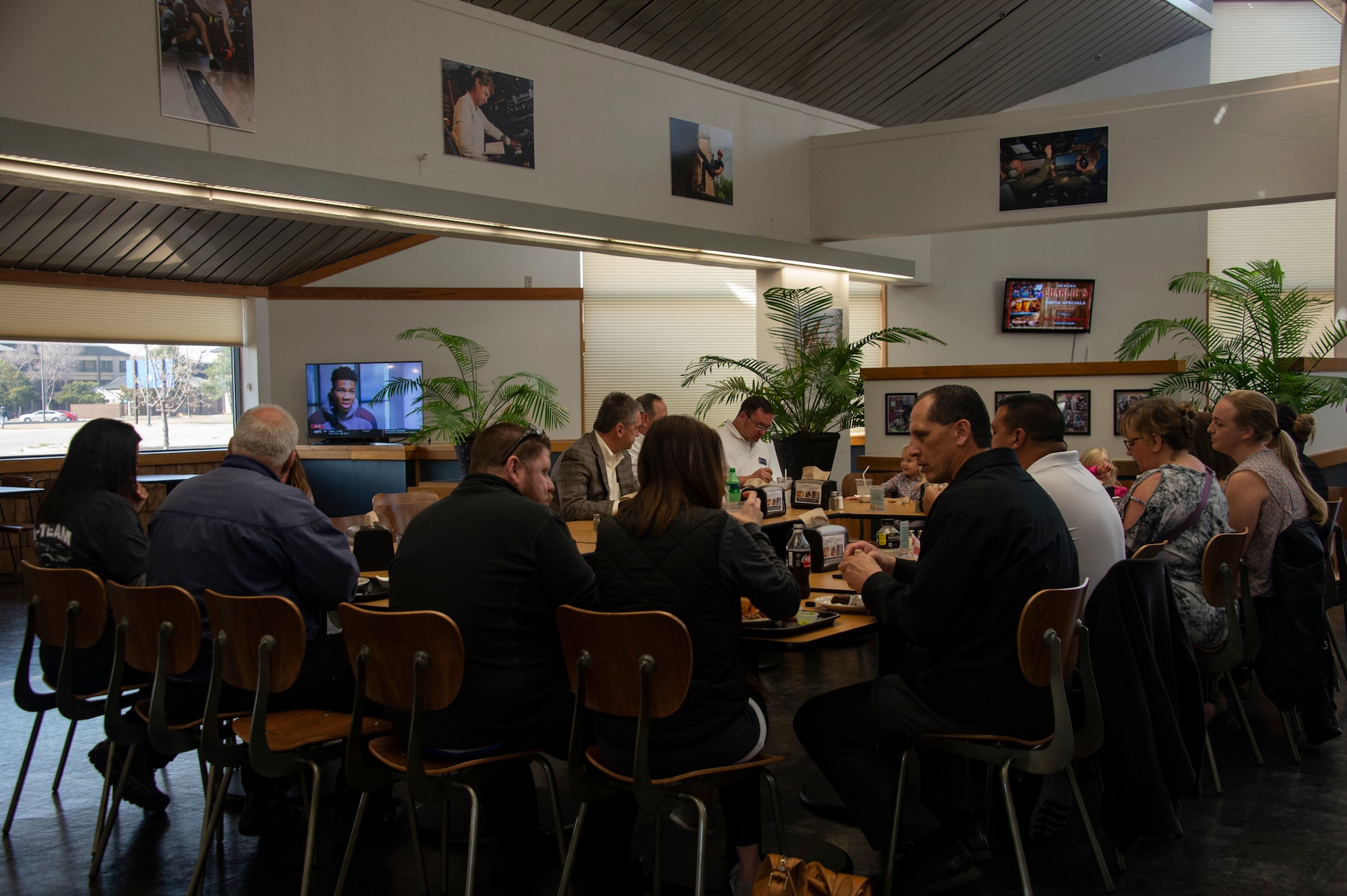 Members of the 97th Maintenance Squadron participate in an immersion lunch, March 26, 2019, at Altus Air Force Base, Okla. Units from across the 97th Air Mobility Wing have meetings and celebrations at Hangar 97. (U.S. Air Force photo by Senior Airman Cody Dowell)