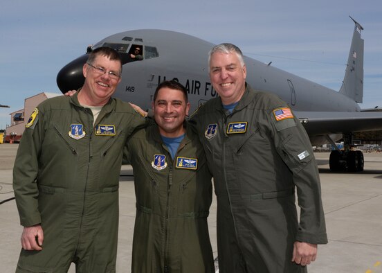 The crew for the final departure of aircraft 57-1419, Master Sgt. John Lennon, boom operator, Lt. Col. Jeffery Cole, co-pilot, and Master Sgt. Glen Starkweather, boom operator from the 157th Operations group pose in front of the oldest aircraft in Air Force inventory, during a ceremony held March 24, 2018 at Pease Air National Guard Base, N.H. The ceremony highlighted the aircraft and the airmen who have served together during the thousands of missions the wing has accomplished. (U.S. Air National Guard photo by  Senior Airman Victoria Nelson)