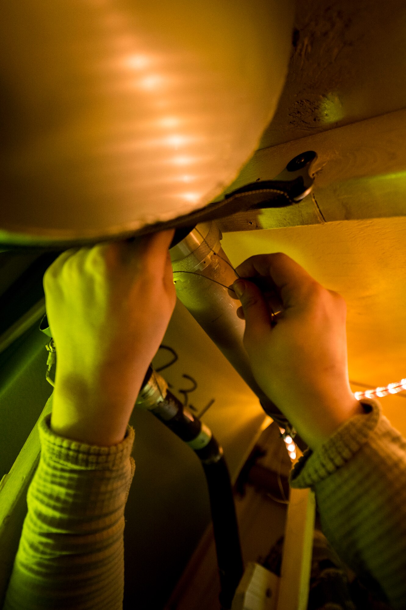 Members of the 133rd Aircraft Maintenance Squadron, Fuel Systems Maintenance shop, practice on maintenance and repairs tasks in a unique enclosed-space simulator that was created to mimic working in a real aircraft fuel tank in St. Paul, Minn., Feb. 23, 2019.