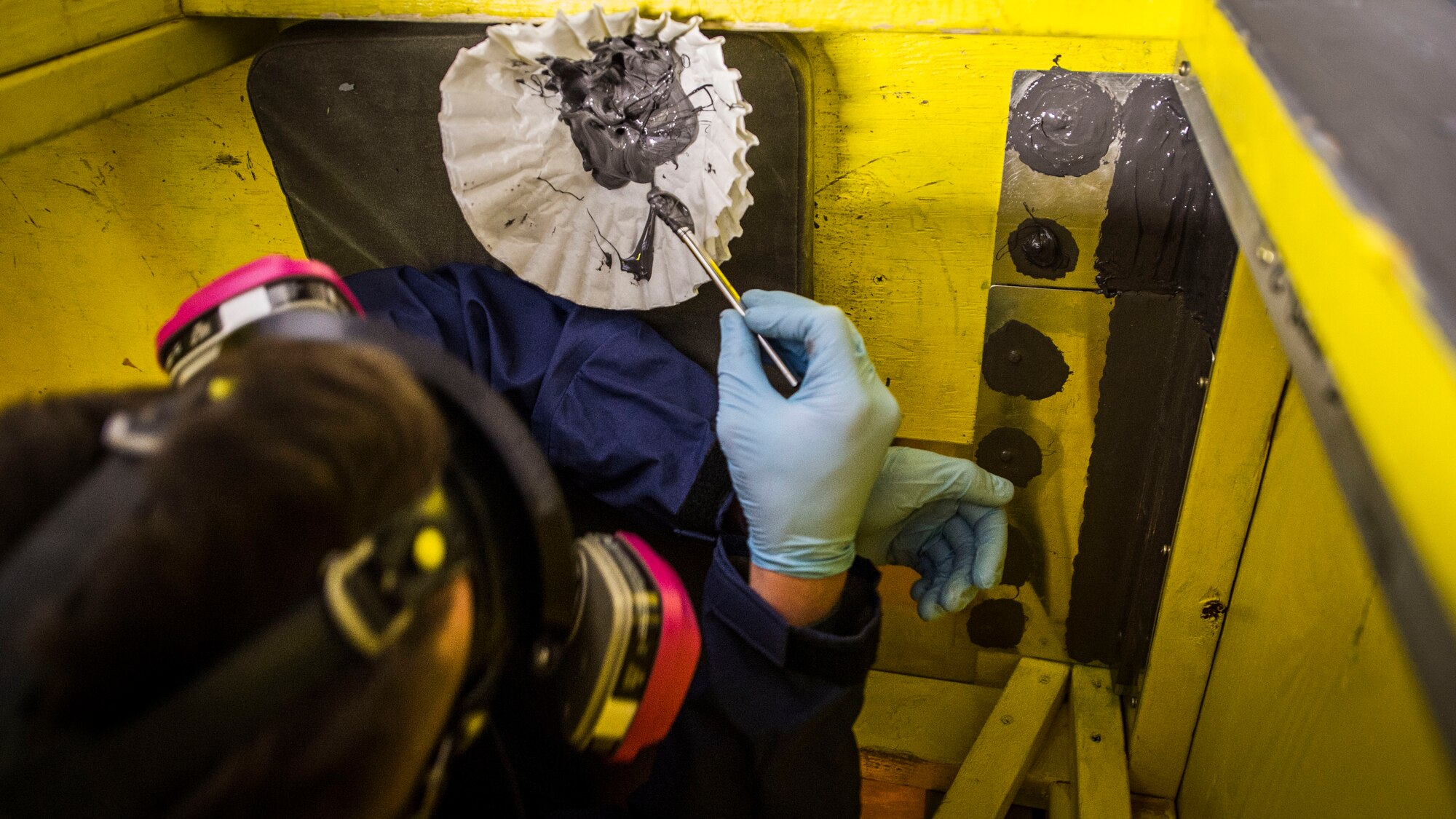 Members of the 133rd Aircraft Maintenance Squadron, Fuel Systems Maintenance shop, practice on maintenance and repairs tasks in a unique enclosed-space simulator that was created to mimic working in a real aircraft fuel tank in St. Paul, Minn., Feb. 23, 2019.
