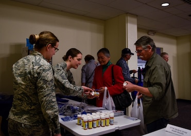People get information and resources from the 377th Medical Group Pharmacy information table at Kirtland Air Force Base, N.M., March 27, 2019. Kirtland’s Retiree Activities Office hosted the military retiree appreciation day where information tables were available to retirees to learn about benefits and resources accessible to them. (U.S. Air Force photo by Airman 1st Class Austin J. Prisbrey)
