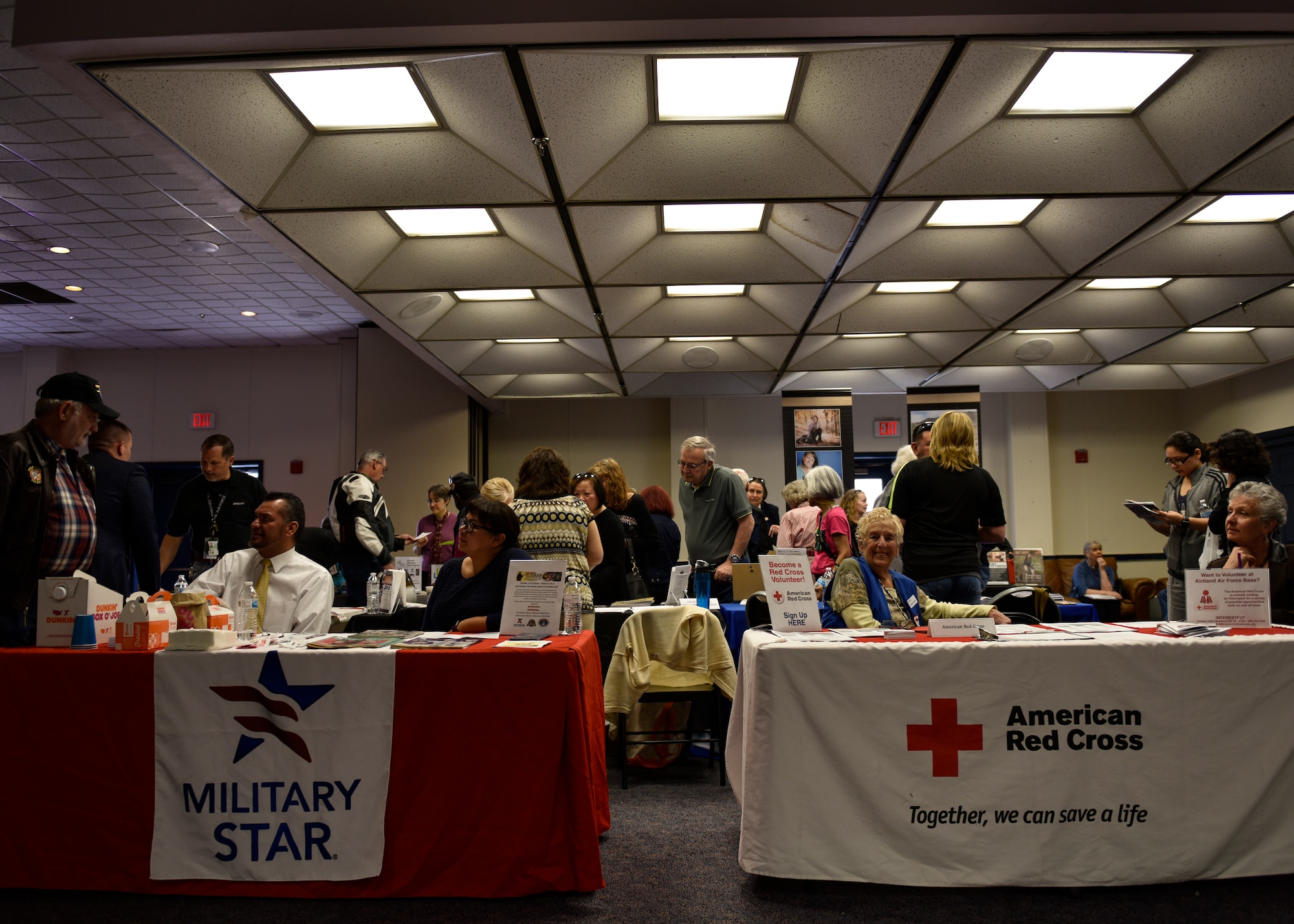 People learn from information tables at military retiree appreciation day at Kirtland Air Force Base, N.M., March 27, 2019. Kirtland’s Retiree Activities Office hosted the military retiree appreciation day where information tables were available to retirees to learn about benefits and resources accessible to them. (U.S. Air Force photo by Airman 1st Class Austin J. Prisbrey)