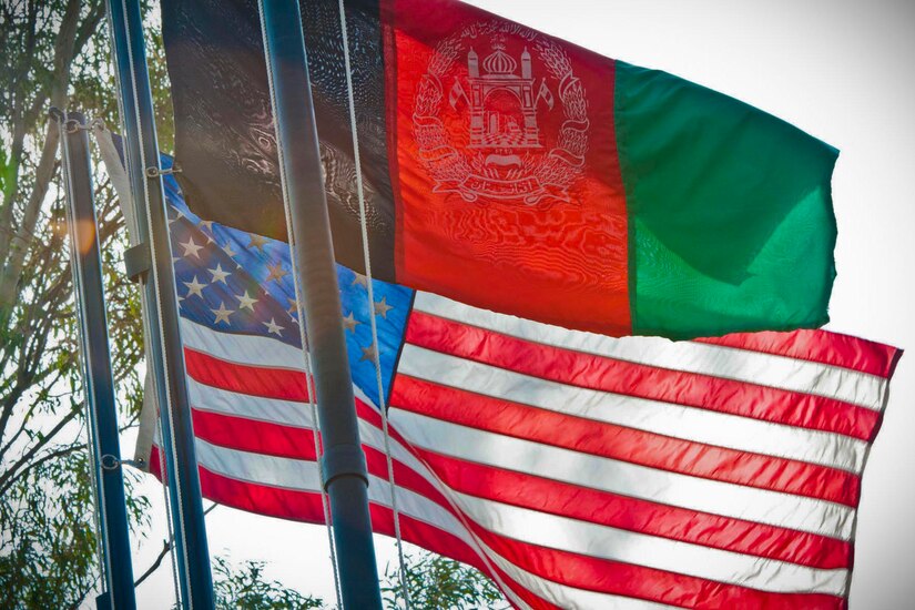 U.S. and Afghanistan flags fly on flagpoles