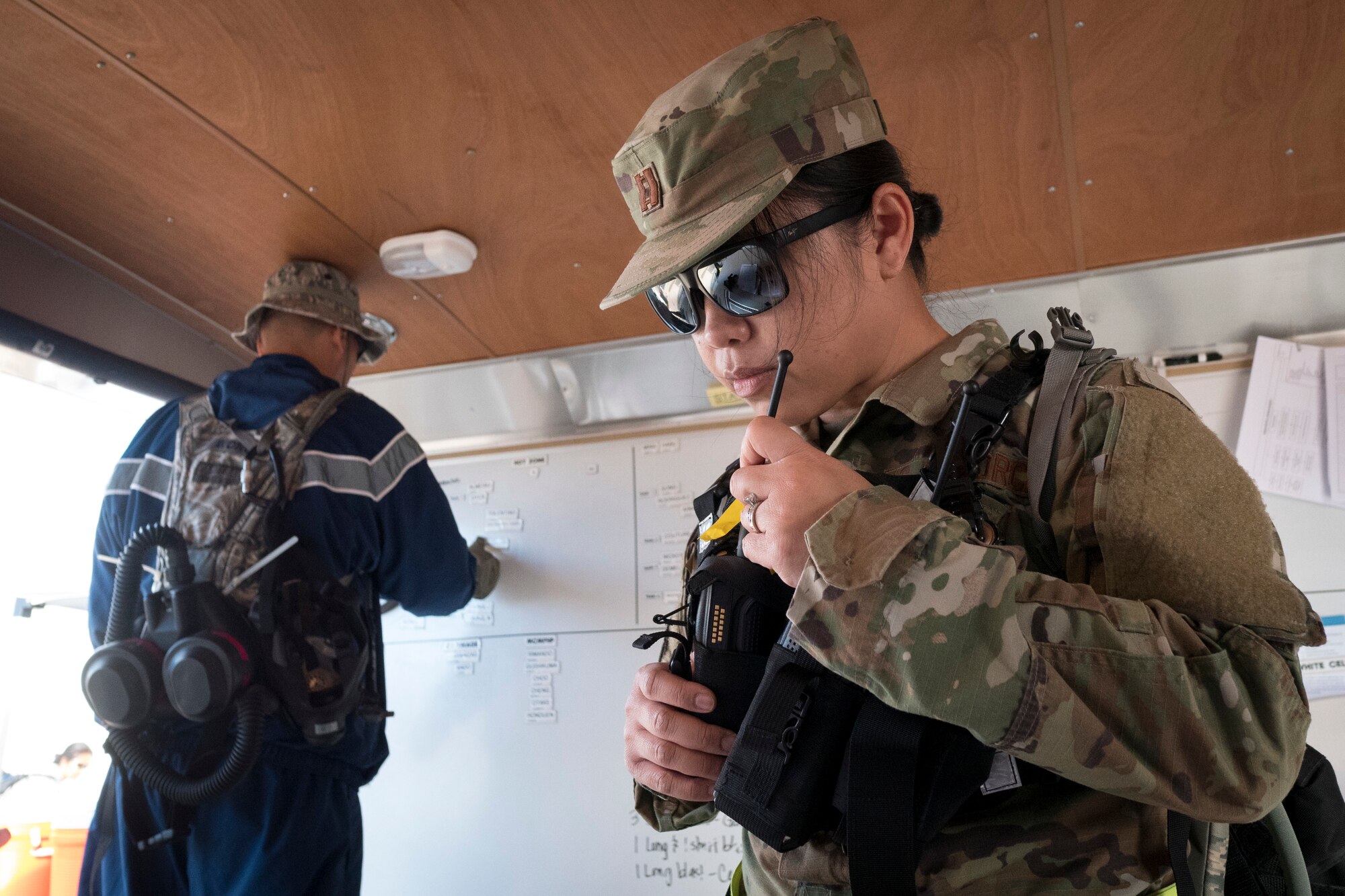Capt. Maria Erc Guisadio-Abis, 154th Medical Group’s Detachment 1 Operations Team chief, transmits mission-essential information zone during an evaluation exercise March 9, 2019, at Kalaeloa, Hawaii.