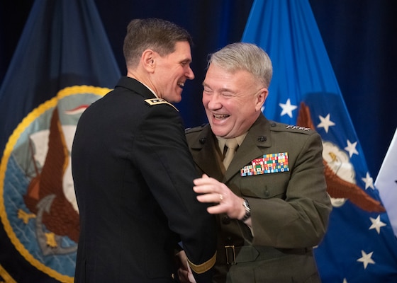 Army Gen. Joseph L. Votel embraces Marine Corps Gen. Frank McKenzie, incoming commander of U.S. Central Command, during a change of command ceremony in Tampa, Florida, March 28, 2019. McKenzie previously served as the director of the Joint Staff.