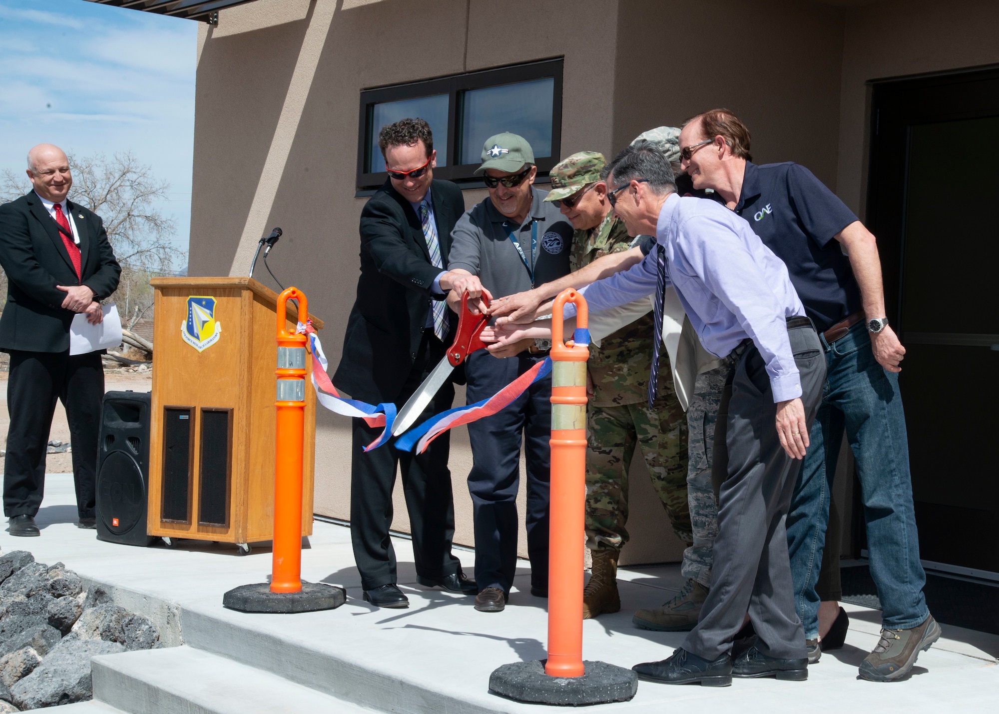 The Air Force Research Laboratory's Space Vehicles Directorate here dedicated the new Navigation Technology Satellite Integration Laboratory March 26, 2019, with a ribbon cutting ceremony. The new facility, official Kirtland's Bldg. 578, will host research and development work on RV's satellite navigation programs. People gathered to celebrate the opening of the new lab, as RV Director Col. Eric Felt and directorate members cut the ceremonial ribbon. (U.S. Air Force photo by Jim Fisher)