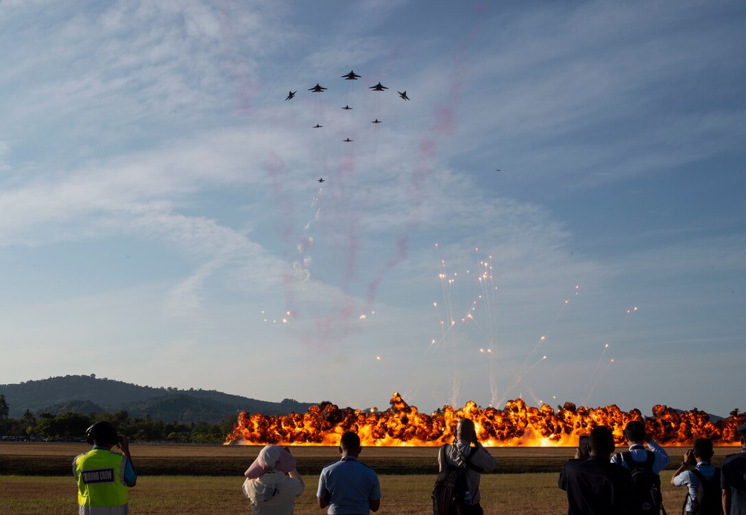 The Malaysian air force performs aerial aerobatics during the opening ceremony for the Langkawi International Maritime and Aerospace Exhibition 2019 in Padang Mat Sirat, Malaysia, March 26, 2019.