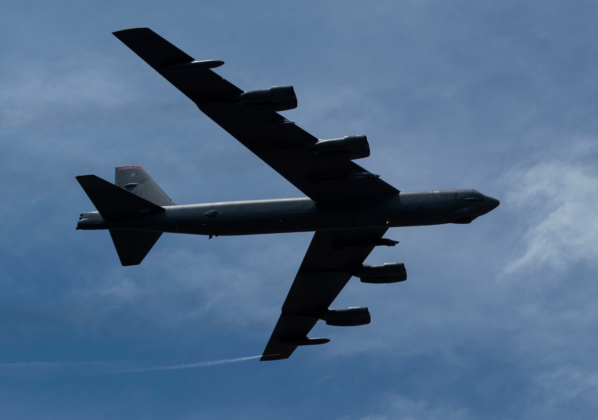 A B-52 Stratofortress assigned to the 23rd Bomb Squadron, Minot Air Force Base, N.D., performs its second and final pass over the Langkawi International Maritime and Aerospace Exhibition 2019 in Padang Mat Sirat, Malaysia, March 26, 2019.