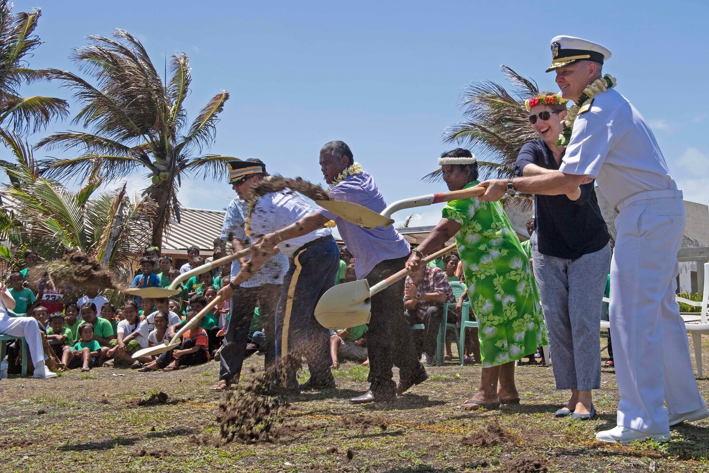 ENNIBURR, Republic of the Marshall Islands (March 26, 2019) Rear Adm. Joey Tynch, Commander, Task Force 73, and special guests dig the first holes during a ground-breaking ceremony during Pacific Partnership 2019. Pacific Partnership, now in its 14th iteration, is the largest annual multinational humanitarian assistance and disaster relief preparedness mission conducted in the Indo-Pacific. Each year, the mission team works collectively with host and partner nations to enhance regional interoperability and disaster response capabilities, increase stability and security in the region, and foster new and enduring friendships in the Indo-Pacific.