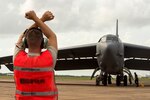 A U.S. Airman assigned to the 5th Maintenance Group marshals a B-52 Stratofortress during Diamond Shield 2019 (DS-19) at Royal Australian Air Force Base Darwin, Australia, March 26, 2019.