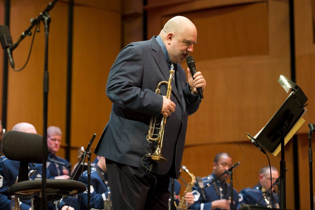 Jazz trumpeter and composer Randy Brecker gives the back story of one of his hits during a Jazz Heritage Series concert at the Rachel M. Schlesinger Concert Hall and Arts Center on the Northern Virginia Community College campus in Alexandria, Va., March 22, 2019. (U.S. Air Force photo by Master Sgt. Michael B. Keller)