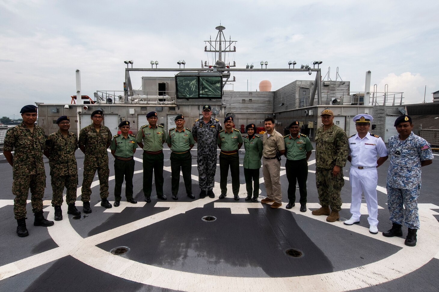 KUCHING, Malaysia (March 28, 2019) – Pacific Partnership 2019 leaders and Malaysian Armed Forces personnel pose for a photo on the flight deck of Military Sealift Command expeditionary fast transport USNS Fall River (T-EPF 4) after the ship moored at the Port of Kuching. Pacific Partnership, now in its 14th iteration, is the largest annual multinational humanitarian assistance and disaster relief preparedness mission conducted in the Indo-Pacific.