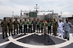 KUCHING, Malaysia (March 28, 2019) – Pacific Partnership 2019 leaders and Malaysian Armed Forces personnel pose for a photo on the flight deck of Military Sealift Command expeditionary fast transport USNS Fall River (T-EPF 4) after the ship moored at the Port of Kuching. Pacific Partnership, now in its 14th iteration, is the largest annual multinational humanitarian assistance and disaster relief preparedness mission conducted in the Indo-Pacific.