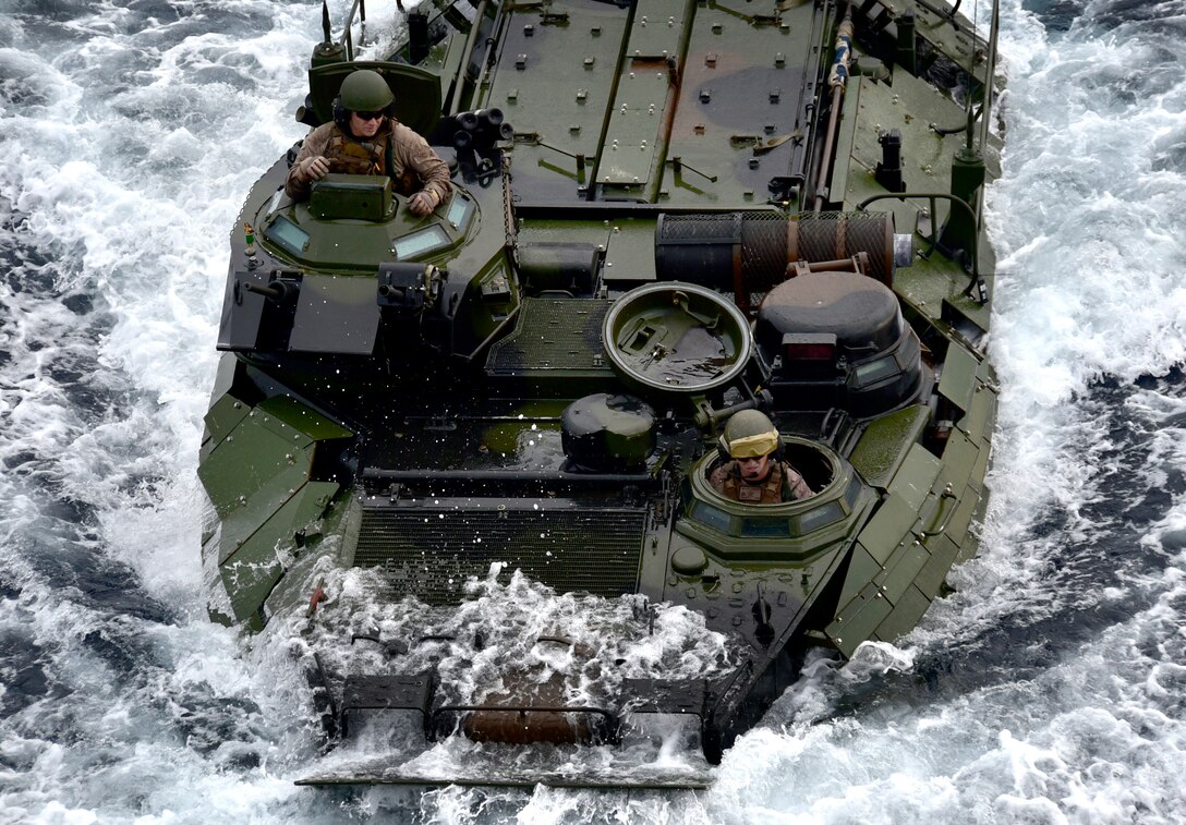 A Marine Corps vehicle operates in the ocean.