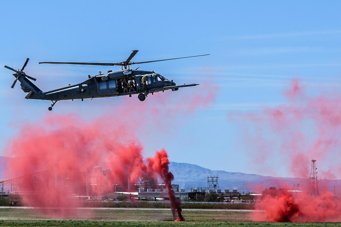 A helicopter lifts off the ground.