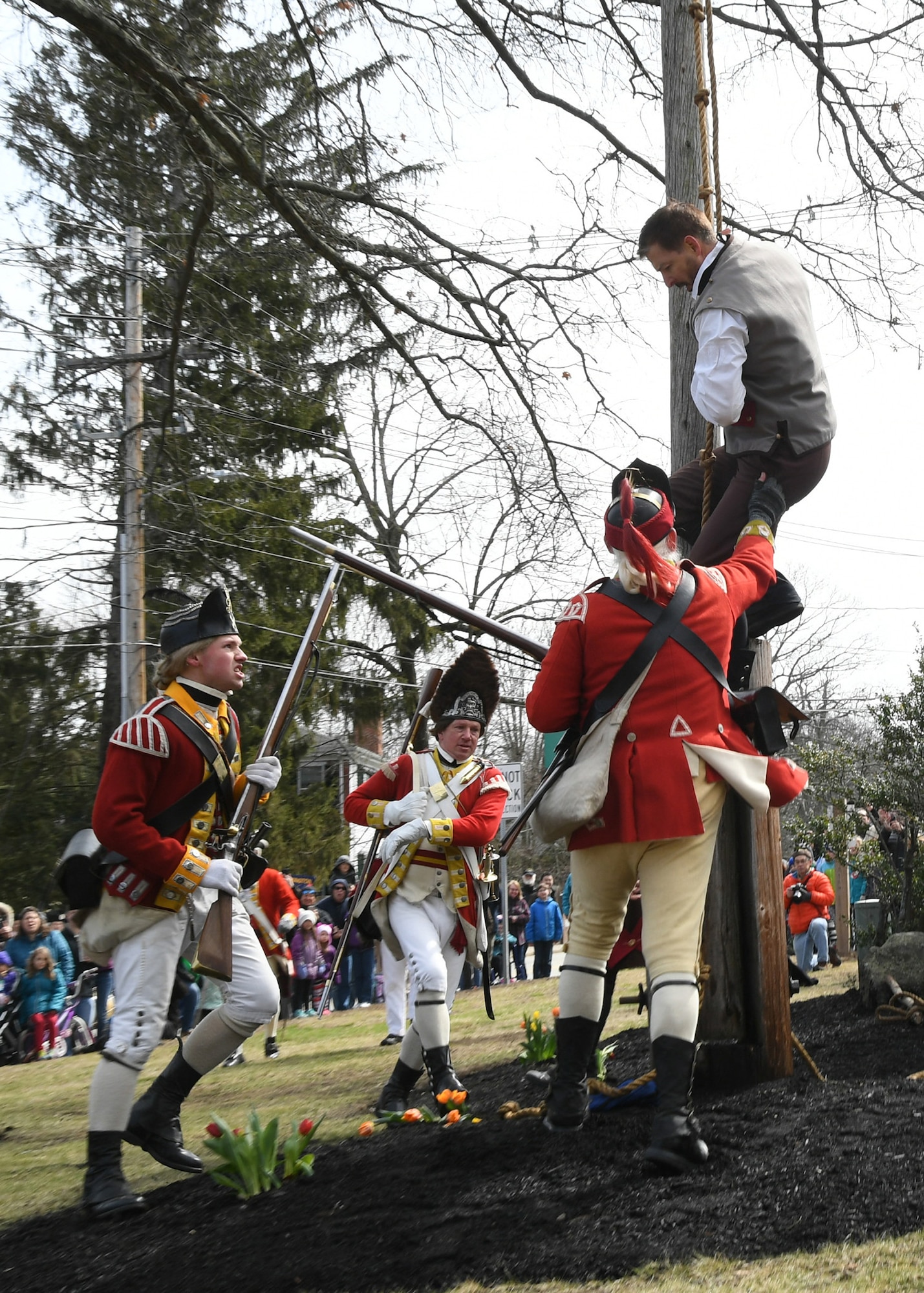 British Regulars re-enactors prepare to arrest a Bedford Minuteman re-enactor during the 2018 Bedford Liberty Pole Capping events on April 7.