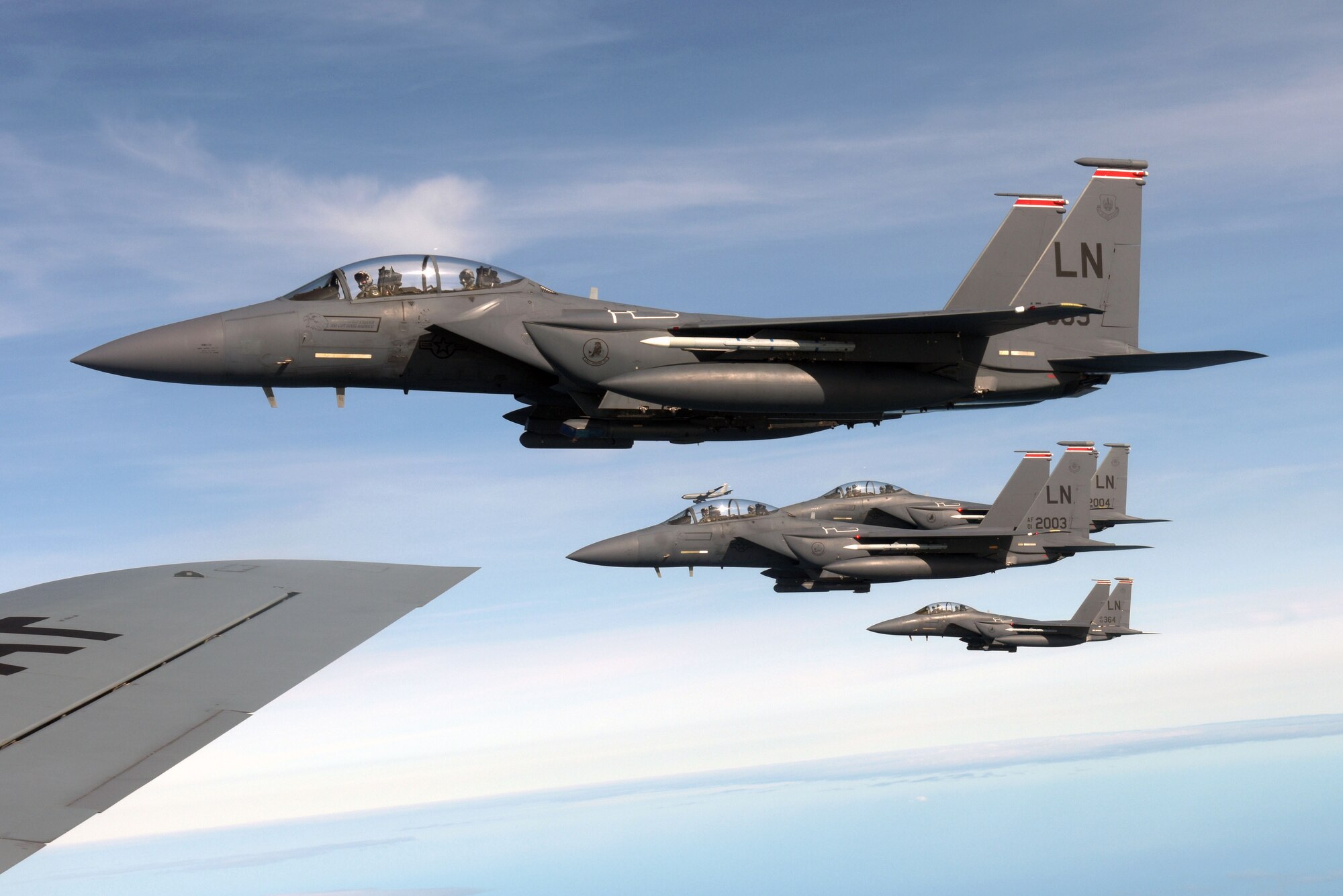 U.S. Air Force F-15E Strike Eagles assigned to the 494th Fighter Squadron at RAF Lakenheath, England, fly in formation along-side a 100th Air Refueling Wing KC-135 Stratotanker near the North Sea, England, March 20, 2019. The Bloody Hundredth provides unrivaled air refueling support throughout Europe and Africa. (U.S. Air Force photo by Senior Airman Benjamin Cooper)