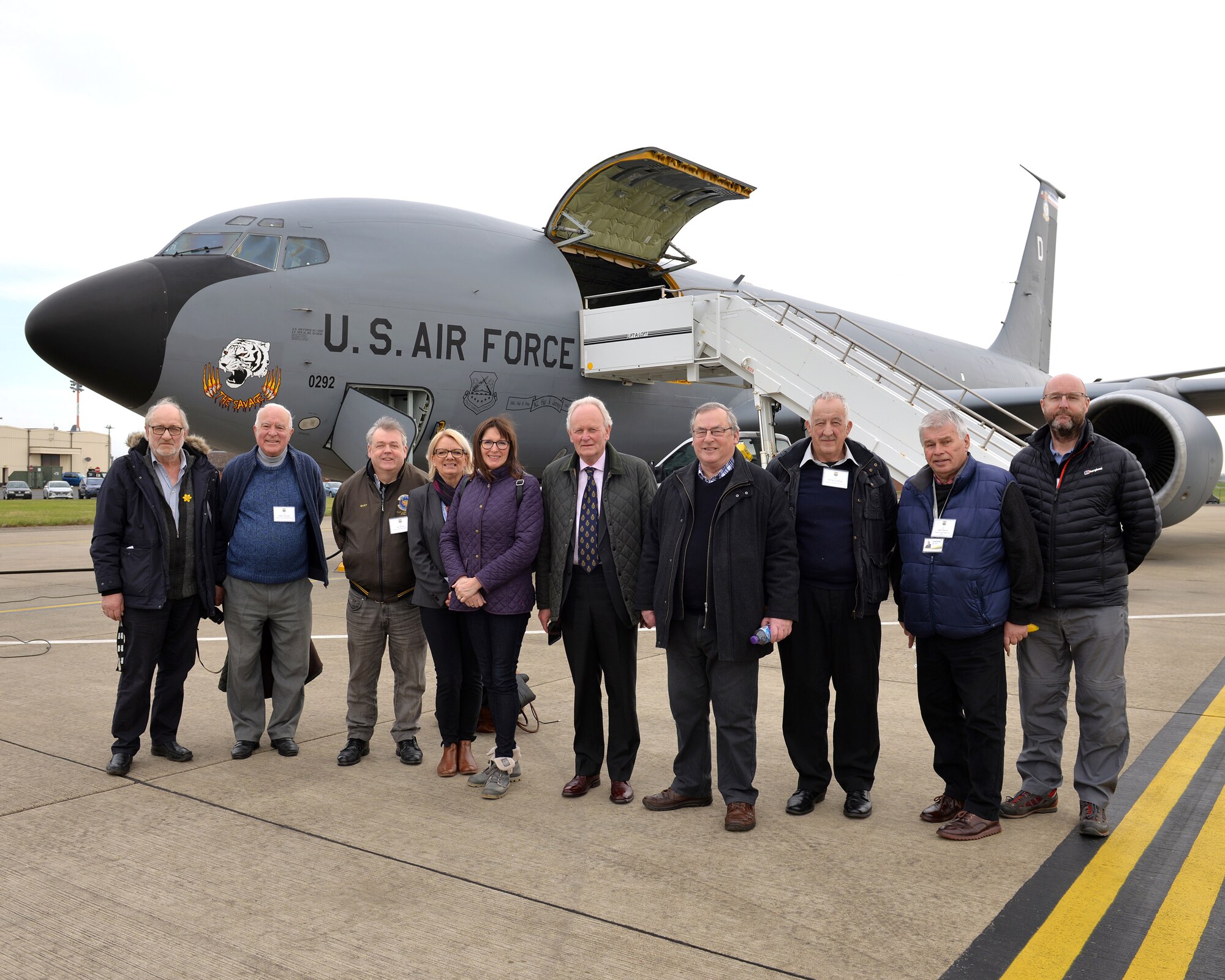 Local civic leaders pose for a picture in front of a U.S. Air Force KC-135 Stratotankerat RAF Mildenhall, England, March 20, 2019. The local guests were able to fly on the Stratotanker and observe in-flight refueling.(U.S. Air Force photo by Karen Abeyasekere)