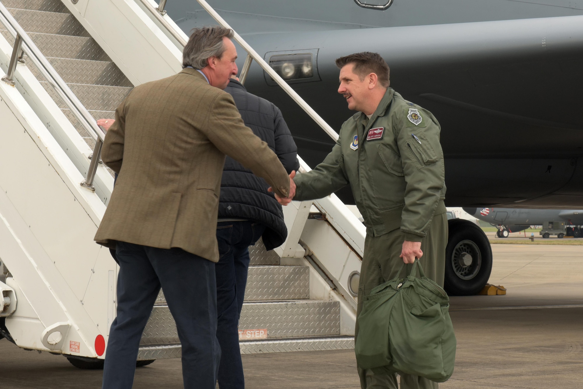 U.S. Air Force Col. Christopher Amrhein, 100th Air Refueling Wing commander, shakes hands with George Vestey, High Sheriff of Suffolk, at RAF Mildenhall, March 20, 2019. Local civic leaders observed RAF Mildenhall operations in an effort to maintain appropriate levels of communication and cooperation between the base and the local populace. (U.S. Air Force photo by Senior Airman Benjamin Cooper)