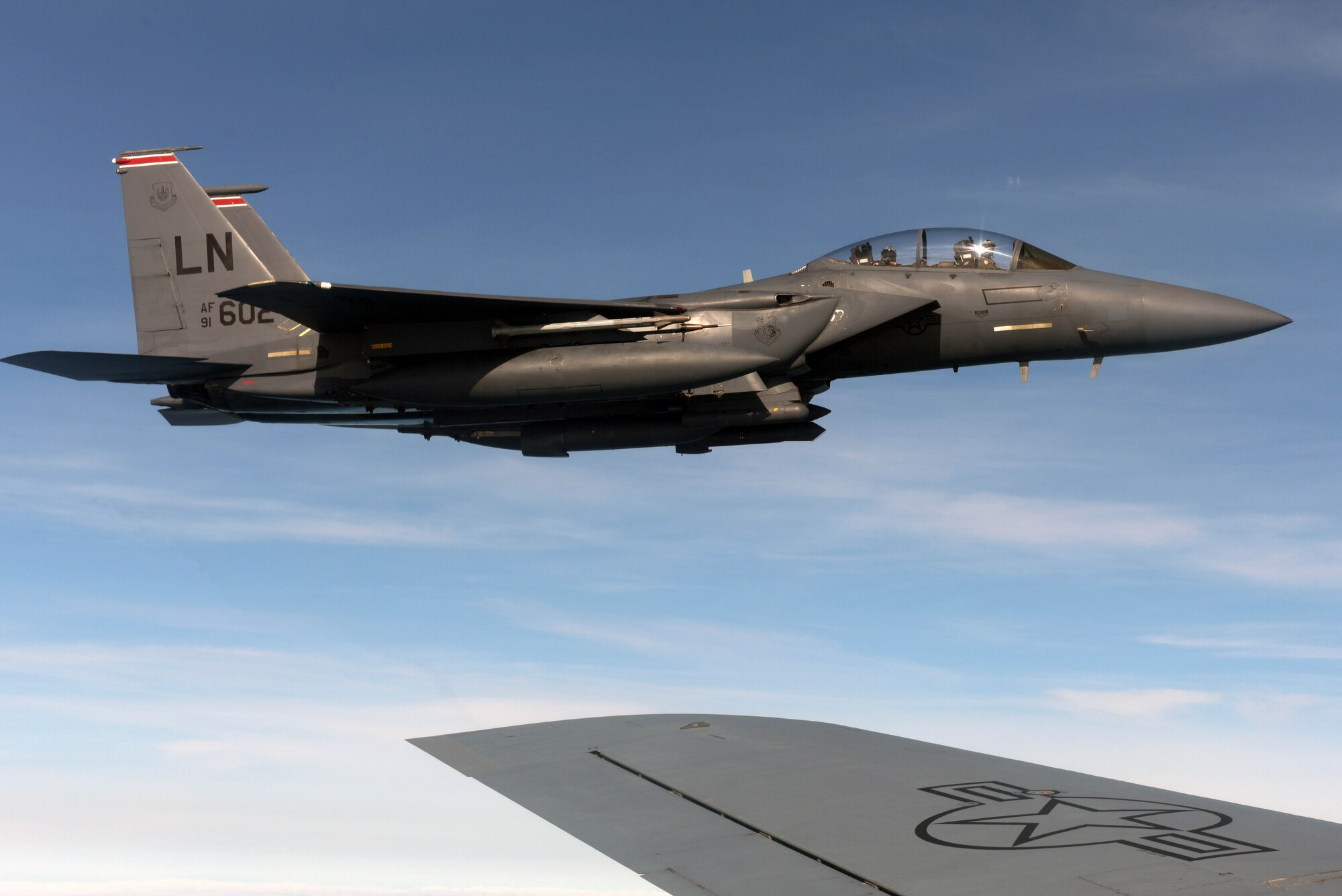 A U.S. Air Force F-15E Strike Eagle assigned to the 494th Fighter Squadron at RAF Lakenheath, England, flies next to a U.S. Air Force KC-135 Stratotanker near the North Sea, England, March 20, 2019. The F-15 serves as an air interdiction and air superiority aircraft for the 494th FS. (U.S. Air Force photo by Senior Airman Benjamin Cooper)