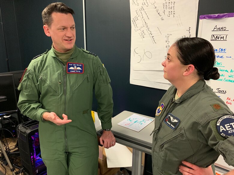 U.S. Air Force Maj. Joanna Nelms, Pilot Training Next flight doctor from 359th Medical Group, talks to Royal Air Force Wing Commander Christopher Pote, Headquarters 22 Group, at the PTN facility at the Armed Forces Reserve Center in Austin, Texas, March 18, 2019. The RAF is participating in PTN's second iteration in an effort to accelerate learning and increase pilot production. (U.S. Air Force photo/Dan Hawkins)